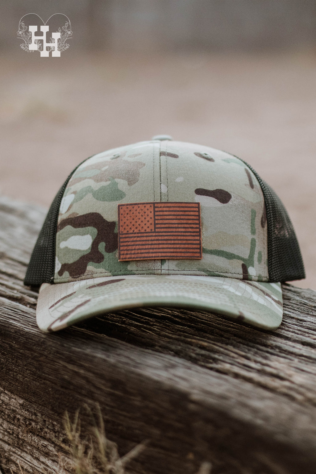 Camouflage trucker baseball hat with a leather United States flag