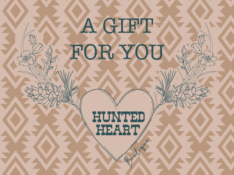 Pink and light brown aztec back ground with the words "A Gift for you" in teal and the Hunted Heart Boutique logo in the same teal.